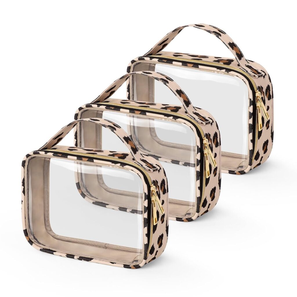 Set of three clear travel toiletry bags with a beige leopard-print trim, sturdy carry handles, and gold-tone zipper closures, designed for organizing cosmetics, toiletries, and travel essentials.